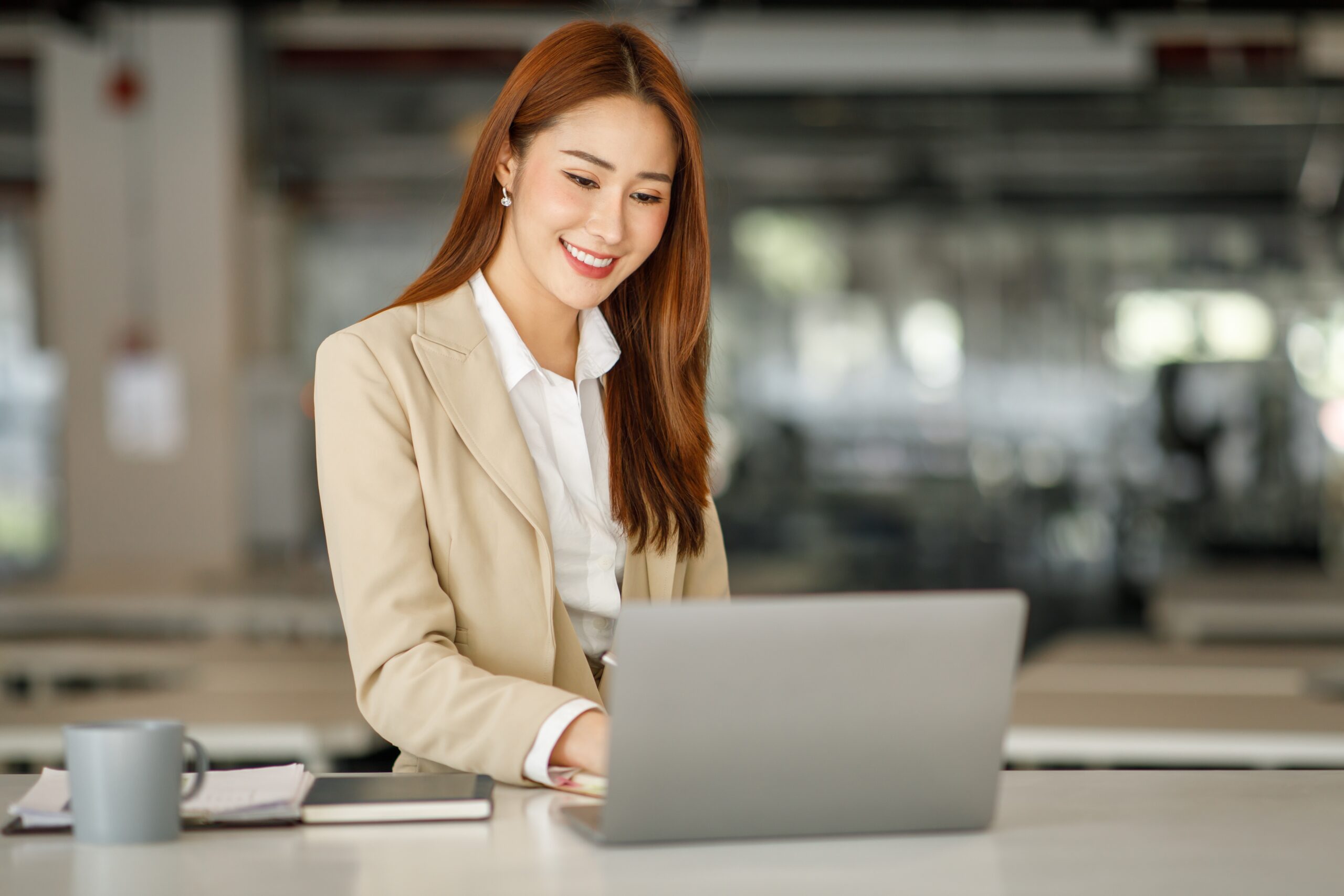 Woman working at a desk.